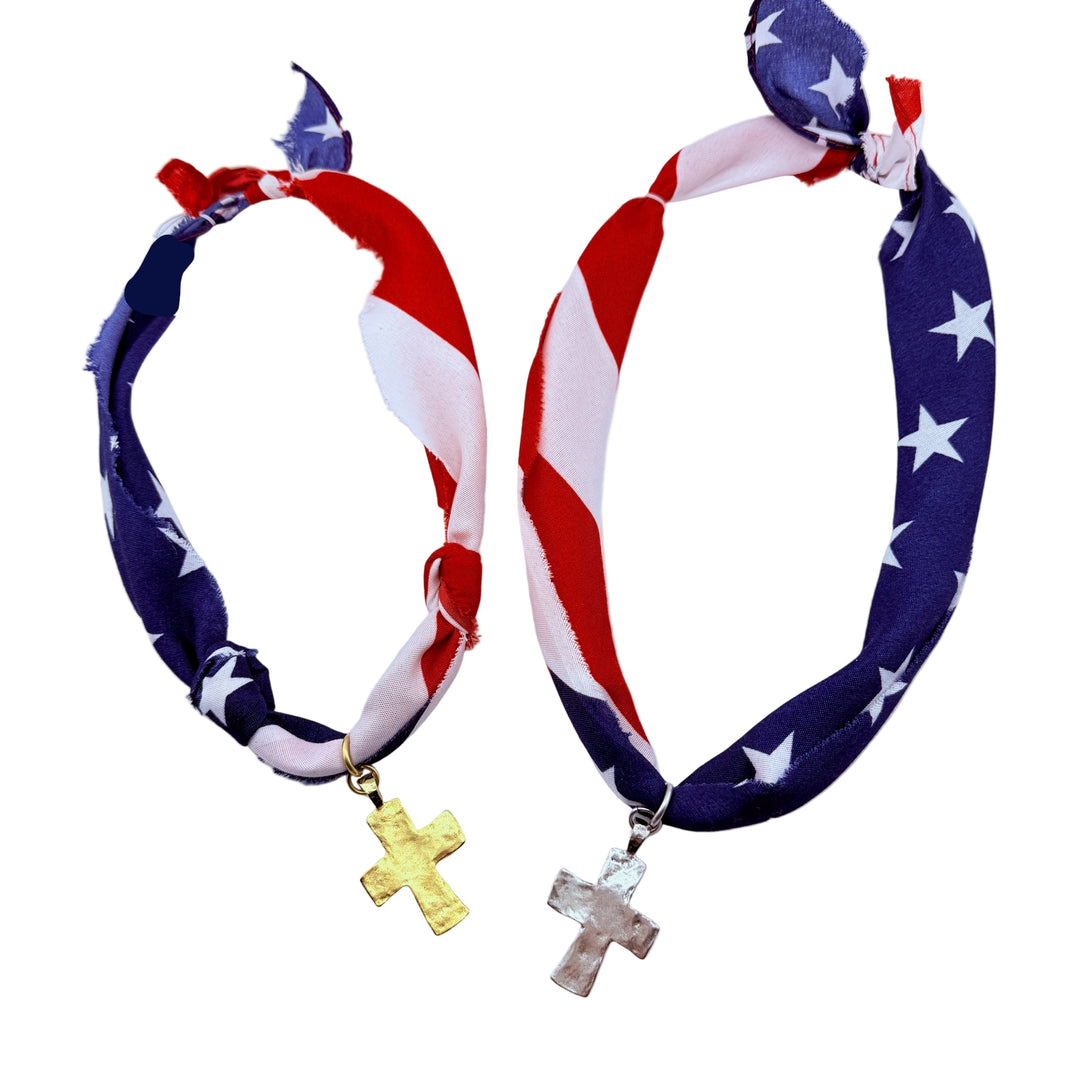 Two American flag-themed necklaces with cross pendants. Adjustable