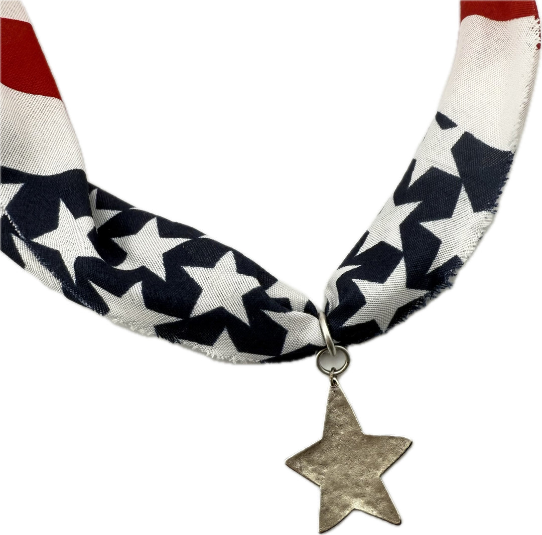 American flag patterned scarf with star pendants.