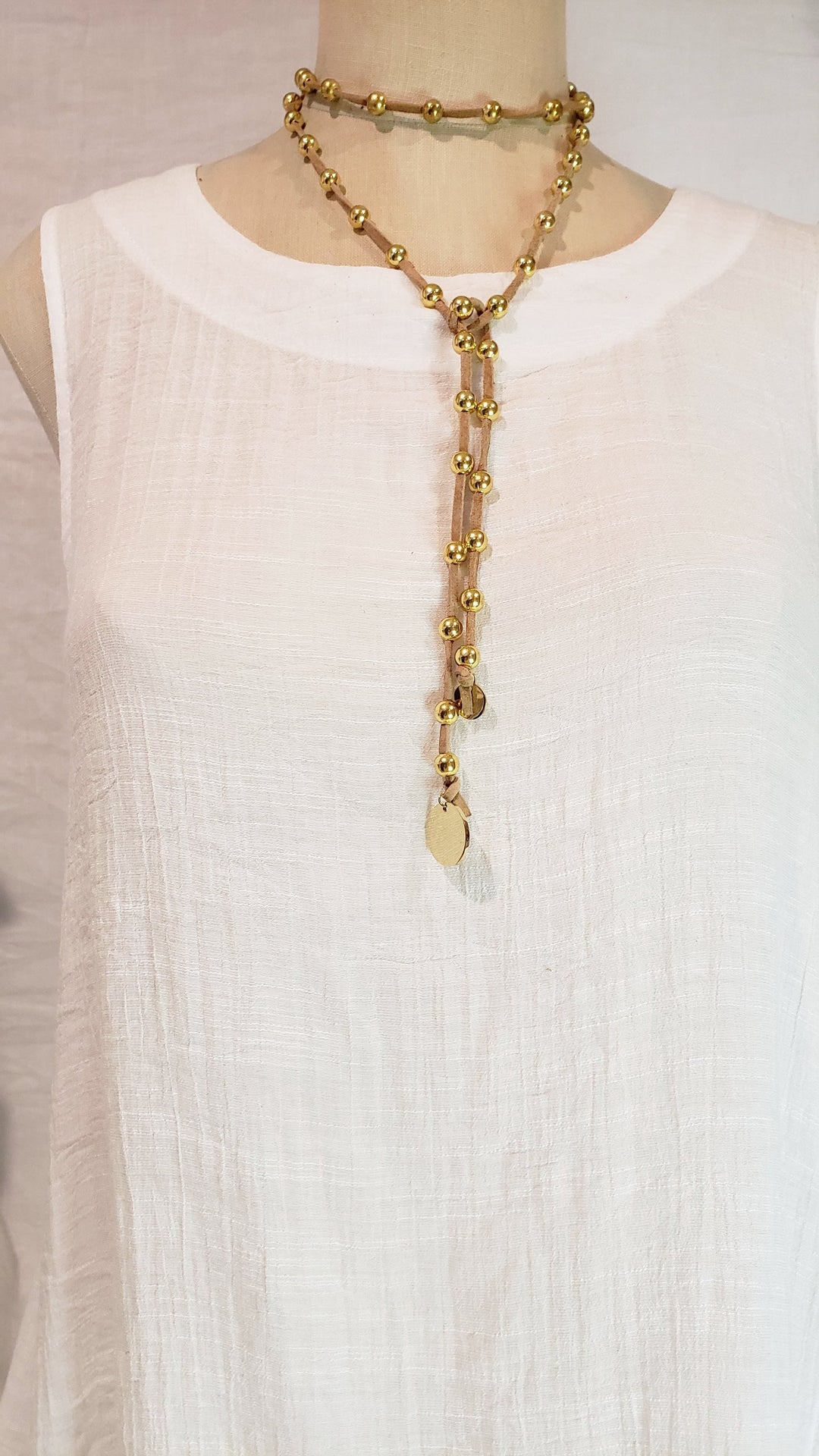 Gold Beaded Lariat Necklace On Suede Leather, Beauty In Stone Jewelry at $80