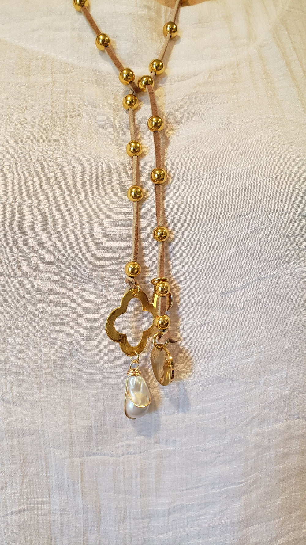 Gold Beaded Lariat With Quatrefoil Clover on Suede Leather, Beauty In Stone Jewelry at $90