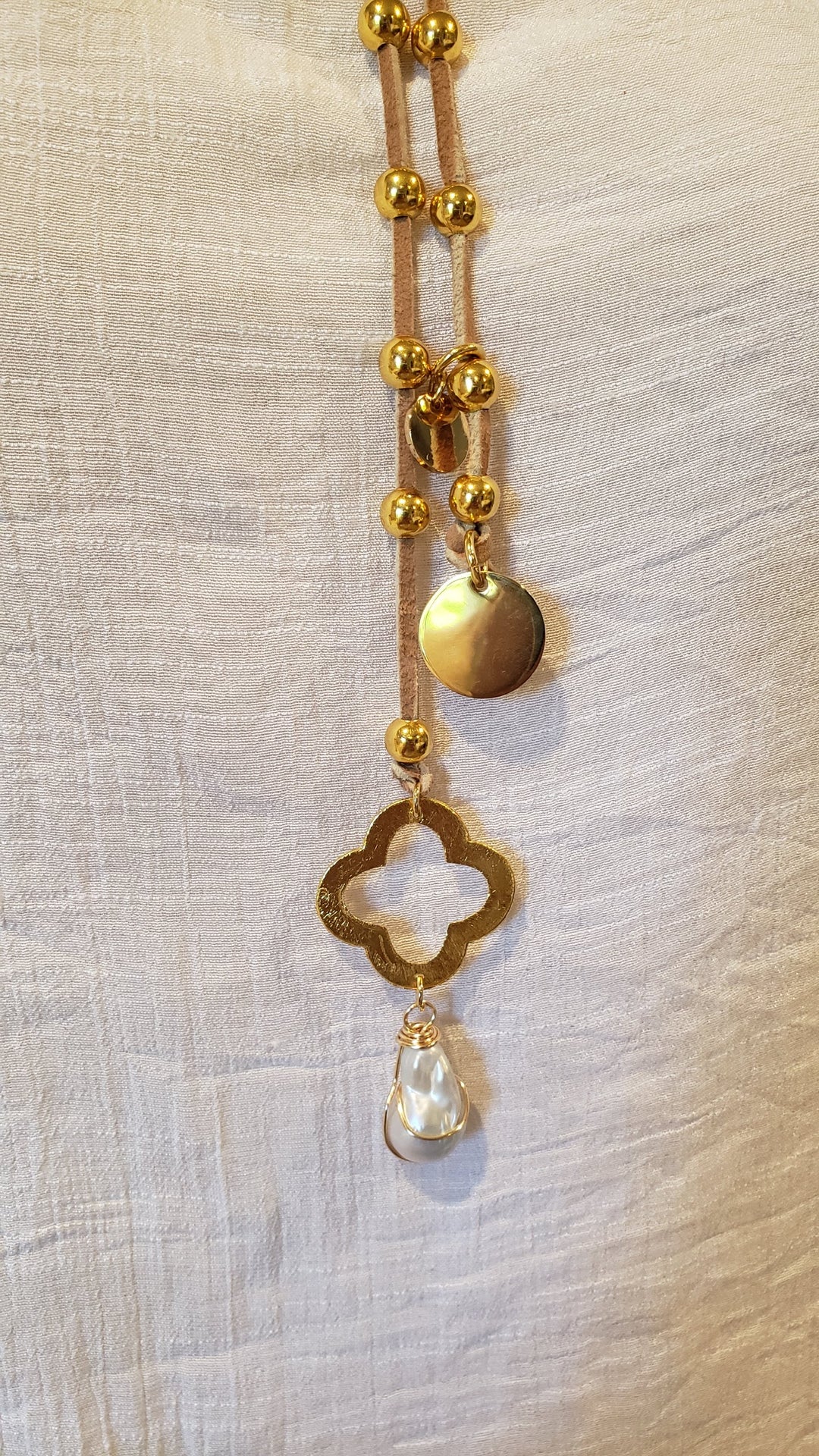 Gold Beaded Lariat With Quatrefoil Clover on Suede Leather, Beauty In Stone Jewelry at $90