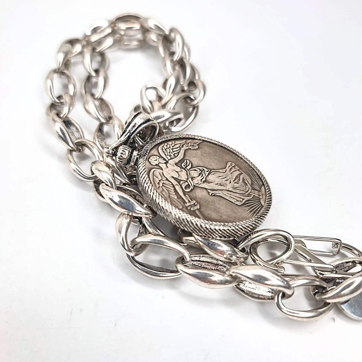 French coin necklace in plain setting with silver chain